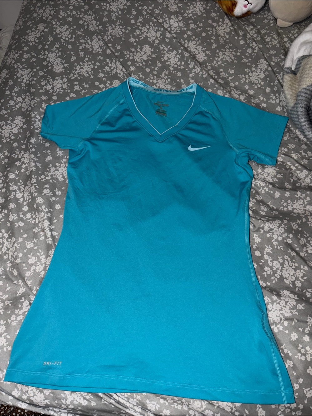 Nike Women's Dri-FIT Short Sleeve V-Neck Top in Teal Blue
